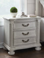 Furniture City - MS - Ashley Furniture - Montelaine Bedroom - King Upholstered Panel Bed / Antique White - B795B6